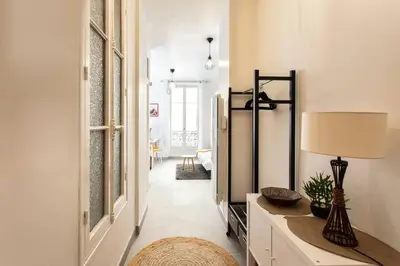 a hallway with a mirror and a table with a lamp at L6 2Rooms 2mins walk from Negresco & Sea AC-Wifi in Nice