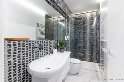 a bathroom with a toilet and a sink and a shower at Nice Renting - BAVASTRO - Luxurious Loft - 2 BedRoom - AC - Balcony - Trendy Neighborhood in Nice