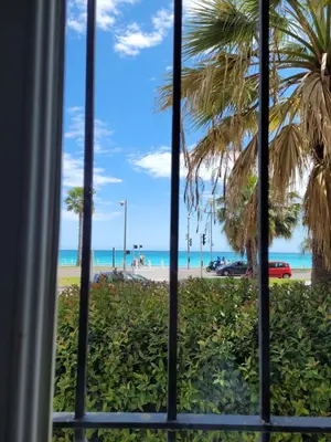 a view from the window of the beach at 2 pièces promenade des anglais in Nice