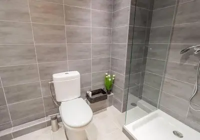 a bathroom with a toilet and a shower at L13 Central flat 5mins walk to beach AC/Balcon/WIFI in Nice