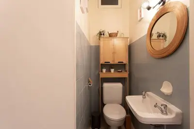 a bathroom with a toilet and a sink and a mirror at L14 2P Promenade Vue Mer climatisé, spacieux/ Balcon in Nice