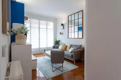 a living room with a couch and a chair at L24 Meyerbeer Promenade 1min SEA & Negresco AC/Balcony in Nice