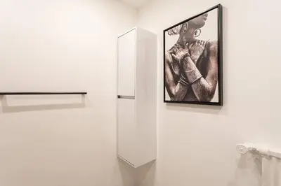 a picture of a man on a wall next to a mirror at L24 Meyerbeer Promenade 1min SEA & Negresco AC/Balcony in Nice