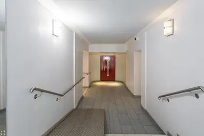 a hallway with a red door in a building at L24 Meyerbeer Promenade 1min SEA & Negresco AC/Balcony in Nice