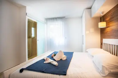 two stuffed animals are laying on a bed at EZE VISTA AP4328 By Riviera Holiday Homes in Èze