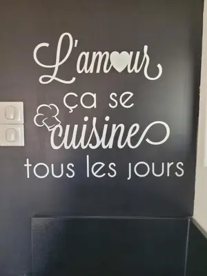 a black wall with a sign that says jamont csa cuisineeus les tours at Chaleureuse bergerie rénovée. in Tourrette-Levens