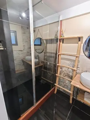 a bathroom with a shower and a sink at Chaleureuse bergerie rénovée. in Tourrette-Levens