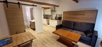 a living room with a couch and a table at Vieux Nice a 2min de la mer in Nice