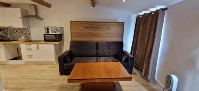 a living room with a couch and a table at Vieux Nice a 2min de la mer in Nice