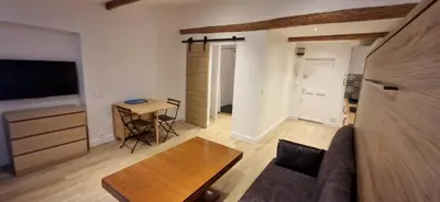 a living room with a couch and a table at Vieux Nice a 2min de la mer in Nice