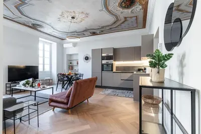 a living room with a coffered ceiling at MY CASA - PHILIBERT - Traditional Apart with Historical Fresc in Nice