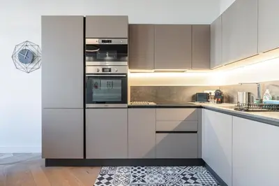 a kitchen with white cabinets and stainless steel appliances at MY CASA - PHILIBERT - Traditional Apart with Historical Fresc in Nice