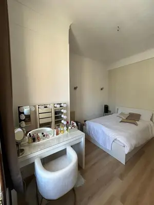 a bedroom with a white bed and a white chair at Nice - Appartement T3 rénové de 50 M2 classé 2 étoiles in Nice